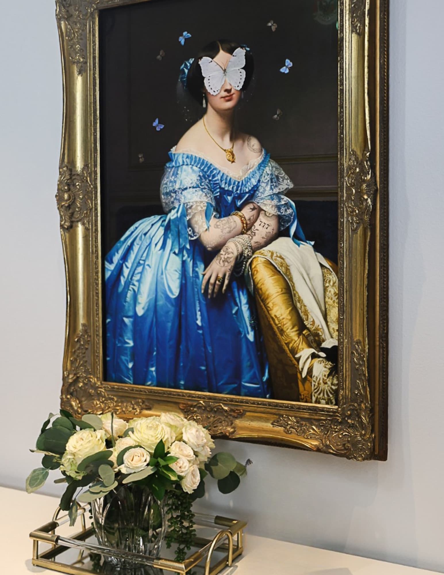 Contemporary butterfly portrait artwork in a gilded frame at Victory Med Spa in Austin, Texas